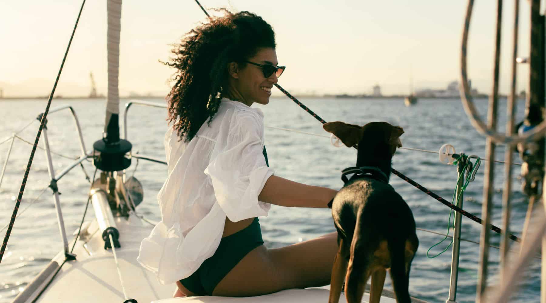Woman on a boat with her dog