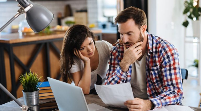 Couple looking at bills