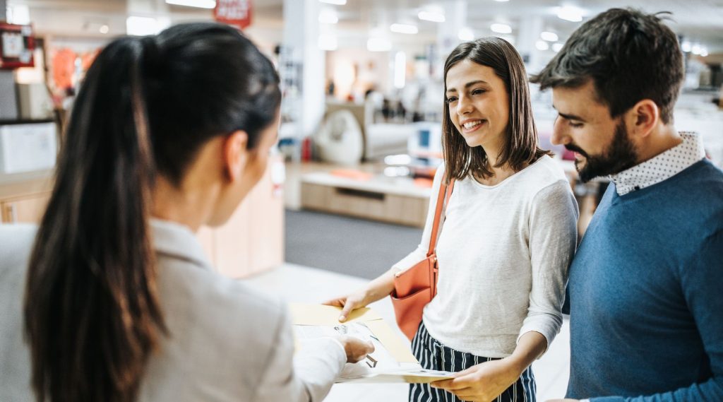 Couple shopping for furniture in-store