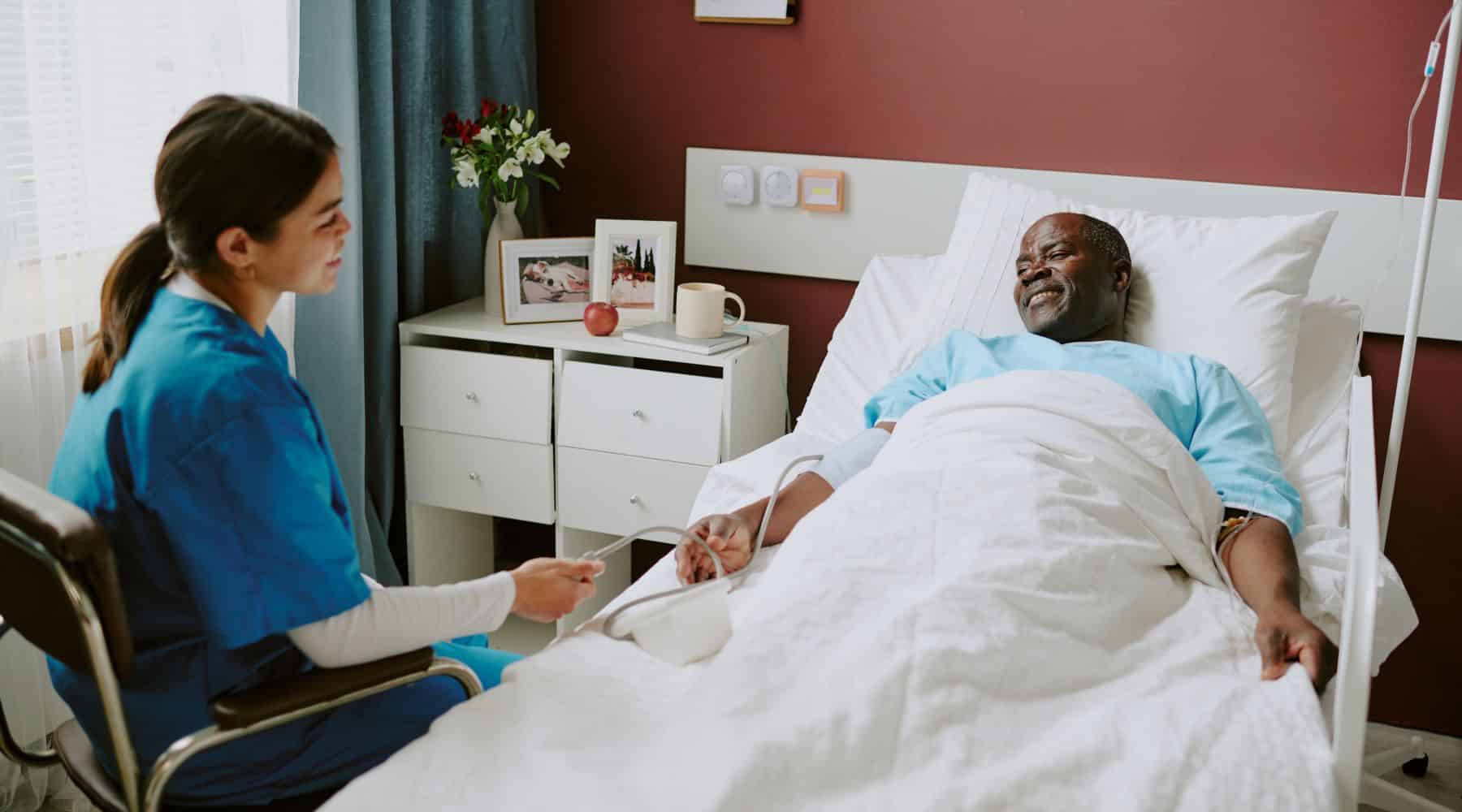 Man receiving health care in hospital bed
