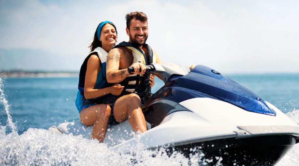 Couple riding a jet ski
