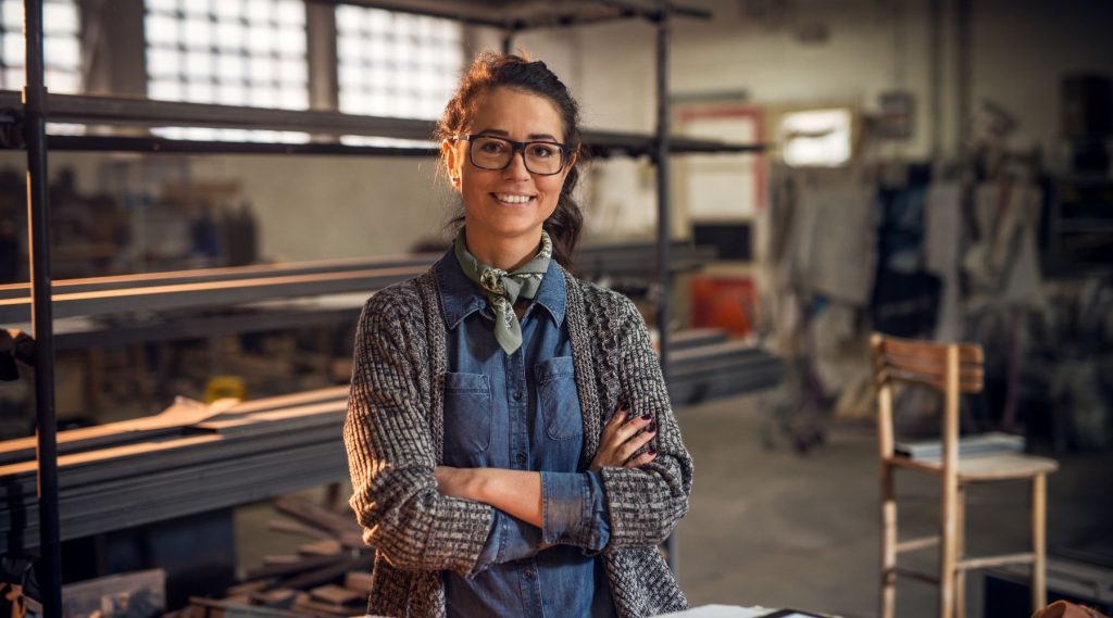 Woman standing in her workshop