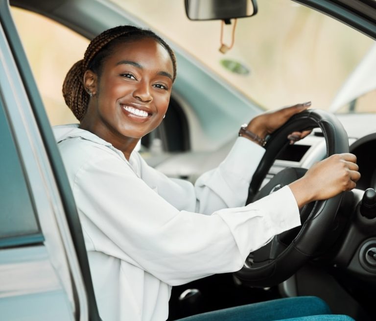Smiling woman in her car