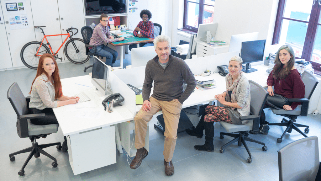 Small business team sitting in office