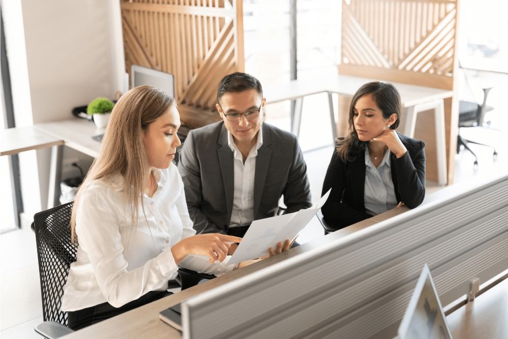Business colleagues discussing a document at a meeting