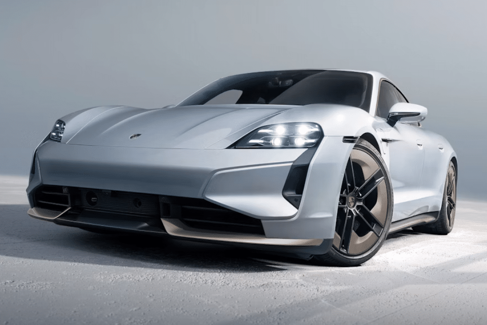 White Porsche Taycan in showroom